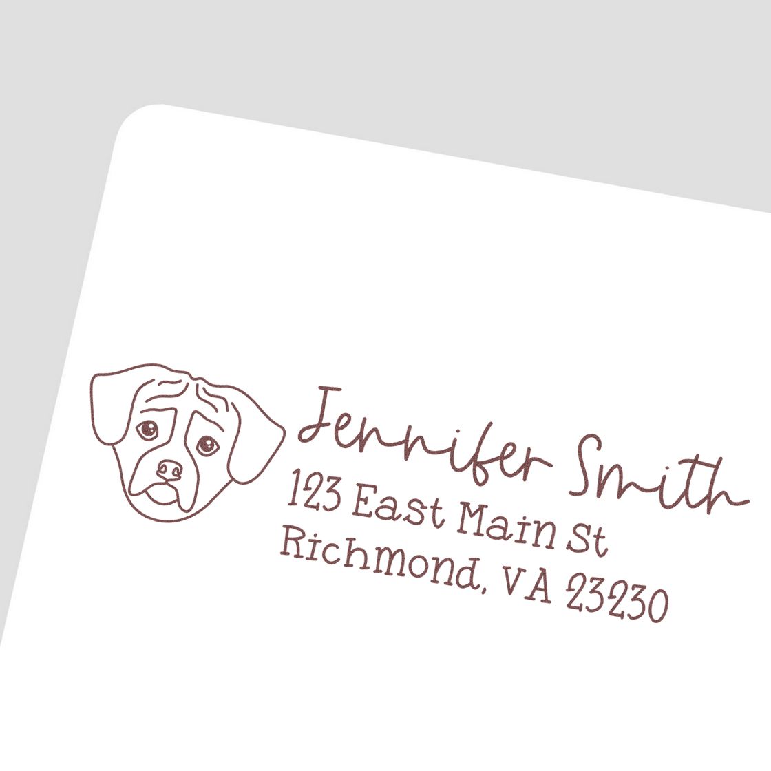 Custom return address rubber stamp with dog illustration for Jennifer Smith, 123 East Main St, Richmond, VA 23230.