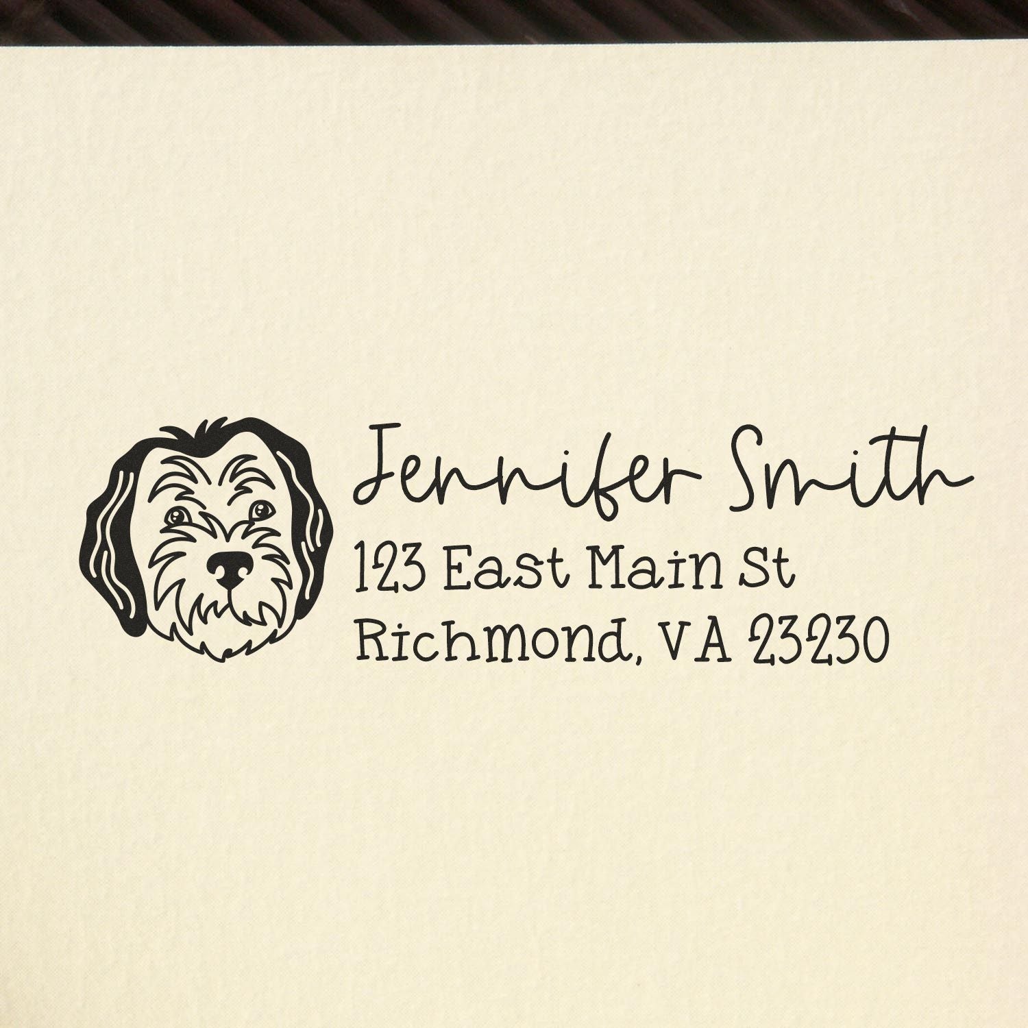 Custom rubber return address stamp with dog portrait for Jennifer Smith, 123 East Main St, Richmond, VA 23230.