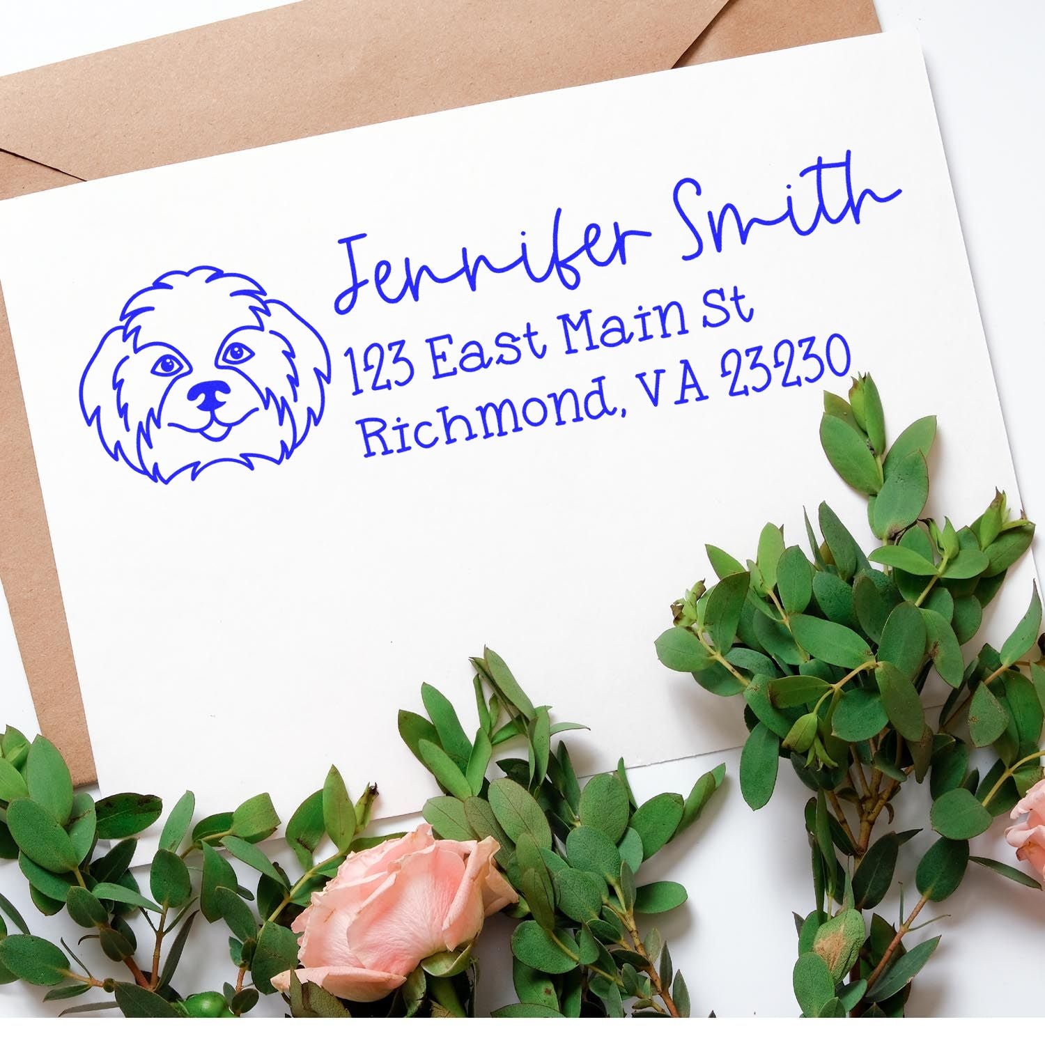Personalized rubber address stamp with dog logo for Jennifer Smith, 123 East Main St, Richmond, VA, on stationery.