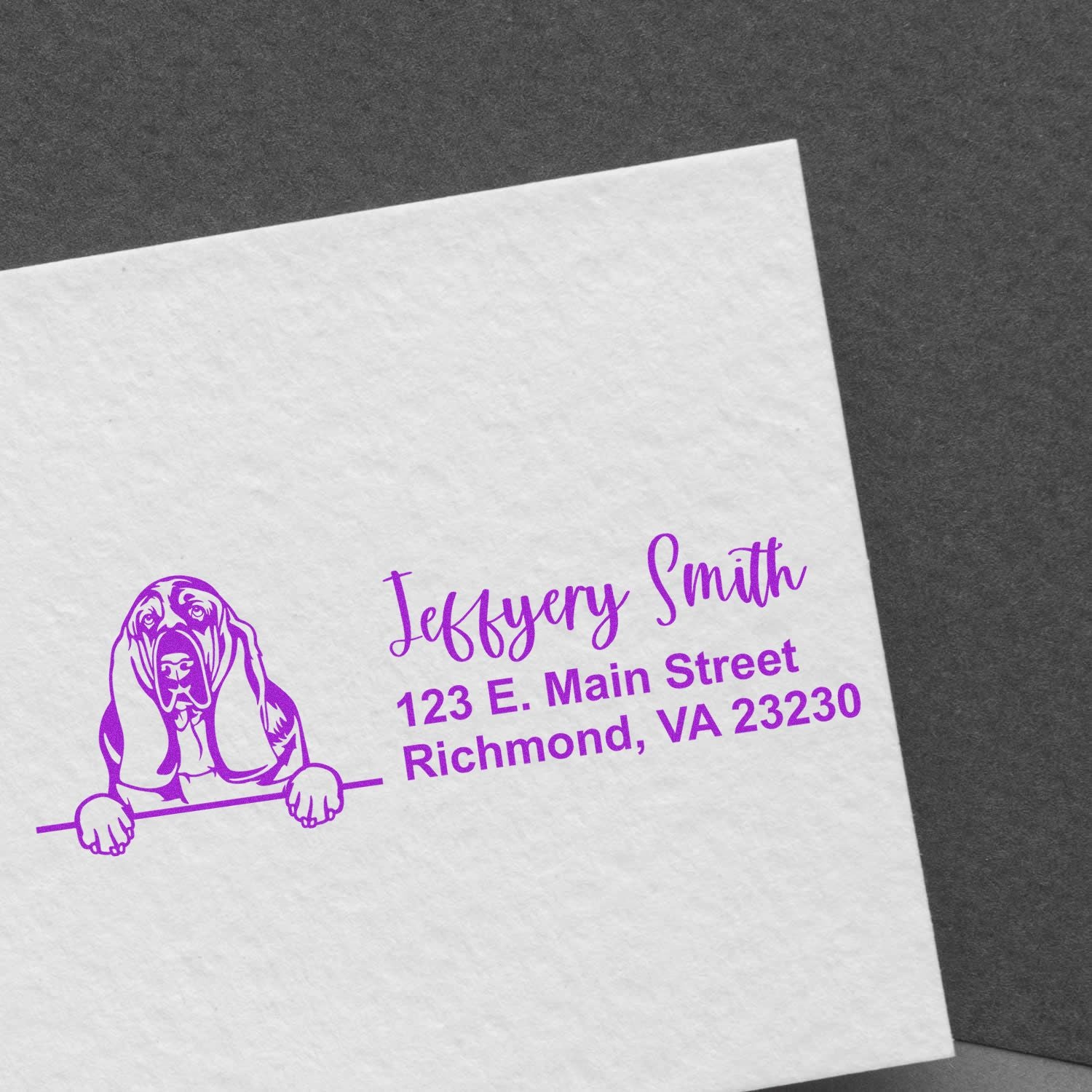 Custom rubber address stamp with dog illustration in purple ink on envelope, featuring name and Richmond, VA address.