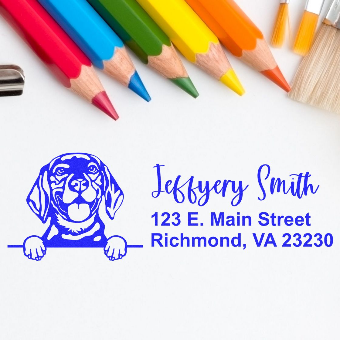 Custom rubber address stamp with dog logo and name, showing personalized return address imprint for packaging and stationery.