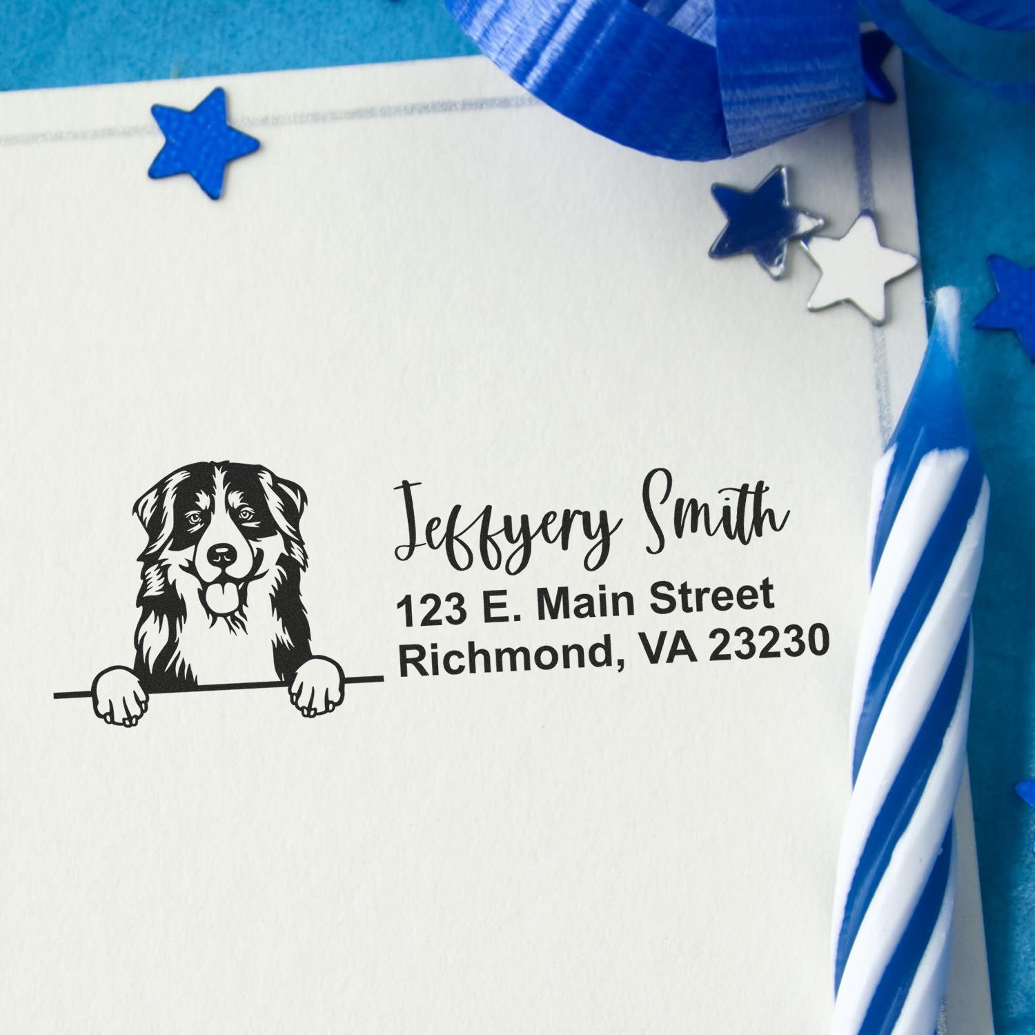 Custom address rubber stamp with dog design, name, and Richmond VA return address on envelope