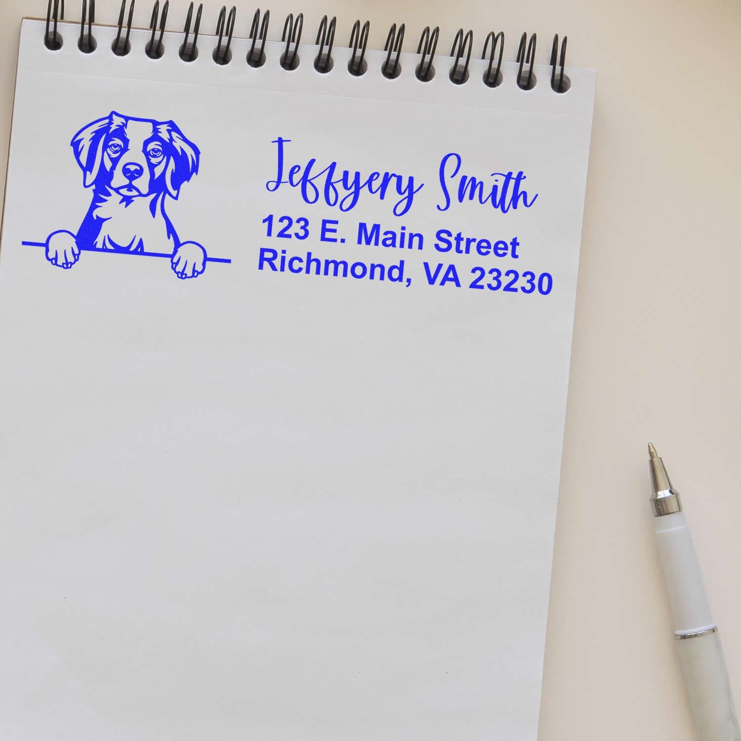 Custom dog return address rubber stamp with name and Richmond, VA address printed on notebook paper.