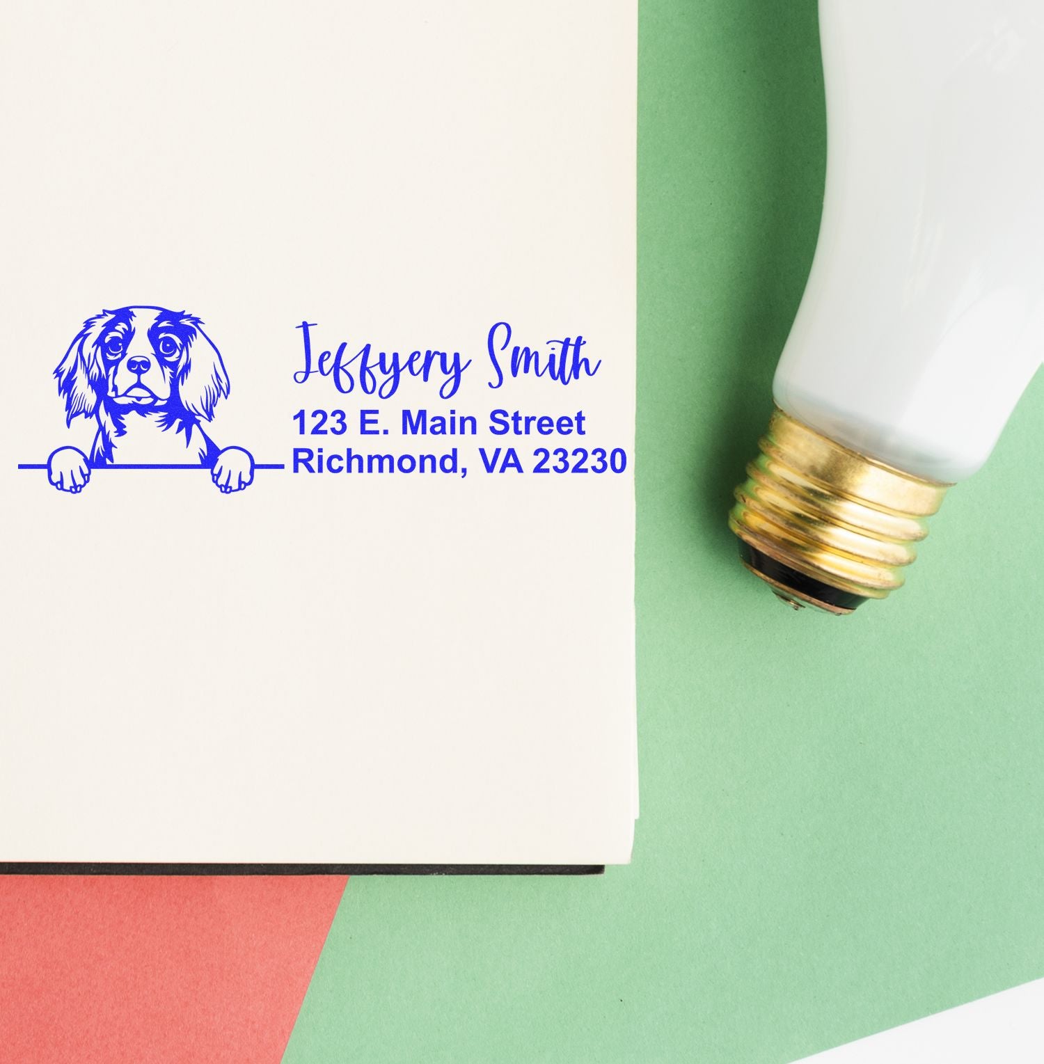 Custom dog return address rubber stamp with name and Richmond, VA address, shown beside an ink bottle.