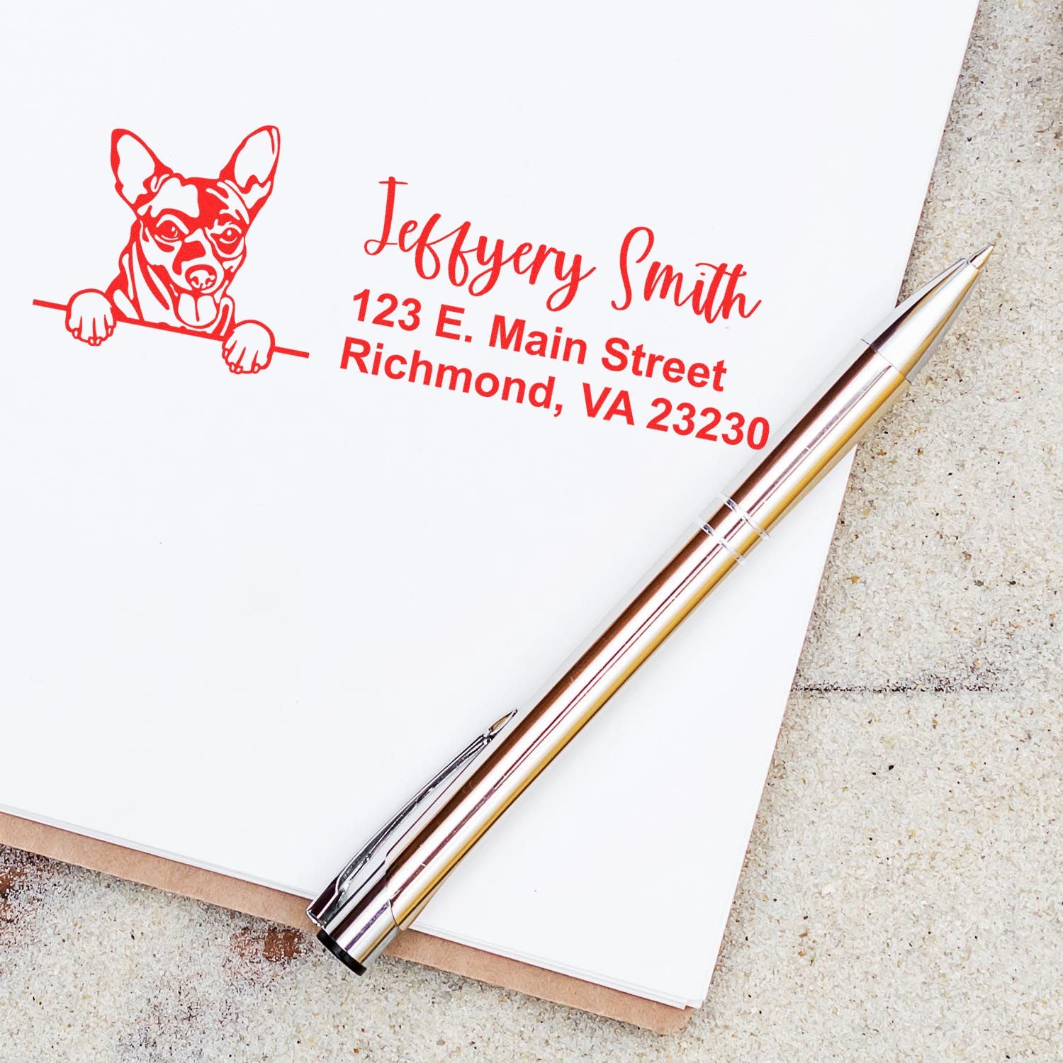 Custom chihuahua return address rubber stamp with name and Richmond, VA address in red on stationery.