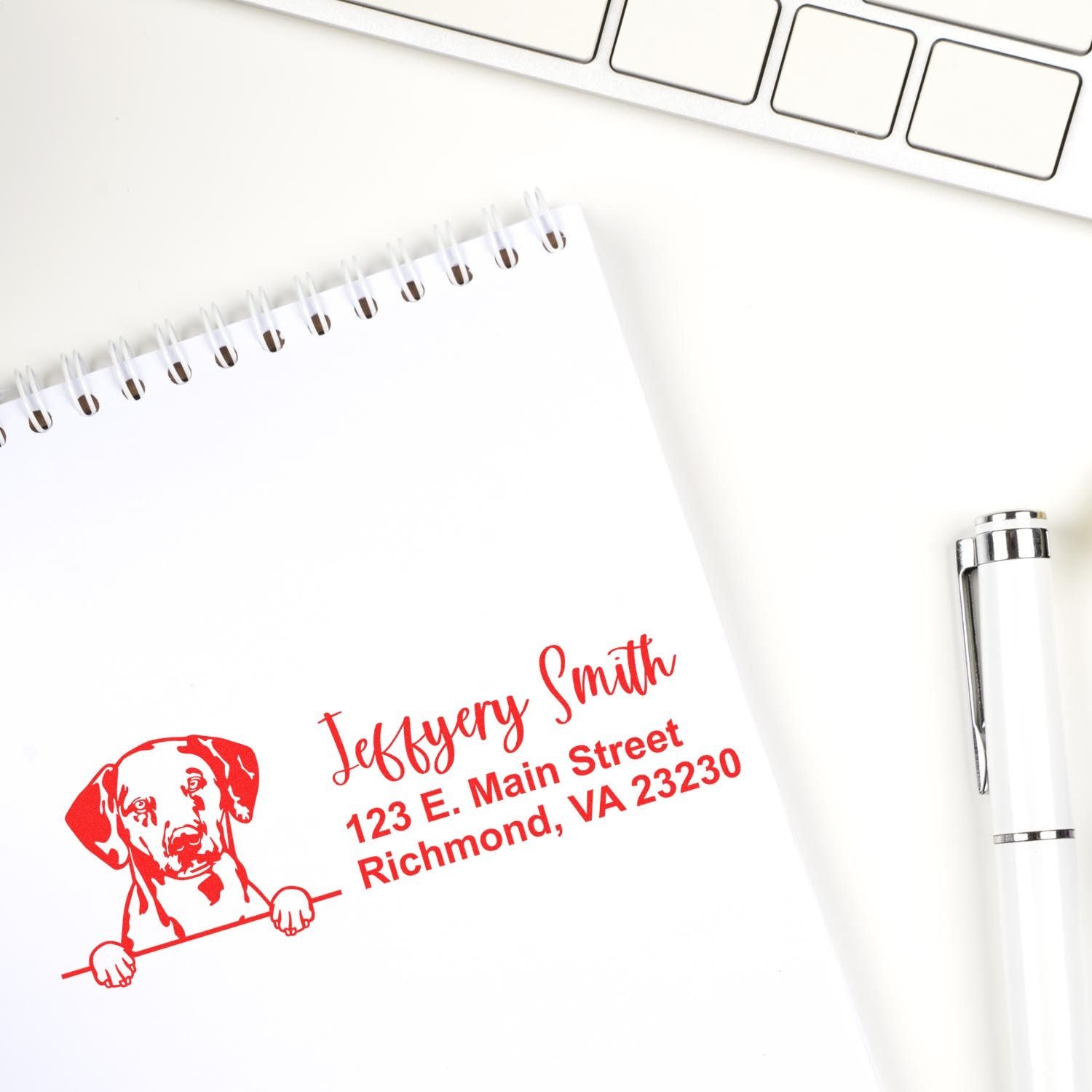 Custom dog address rubber stamp imprint on notebook, showing personalized name and Richmond, VA address for mailing.