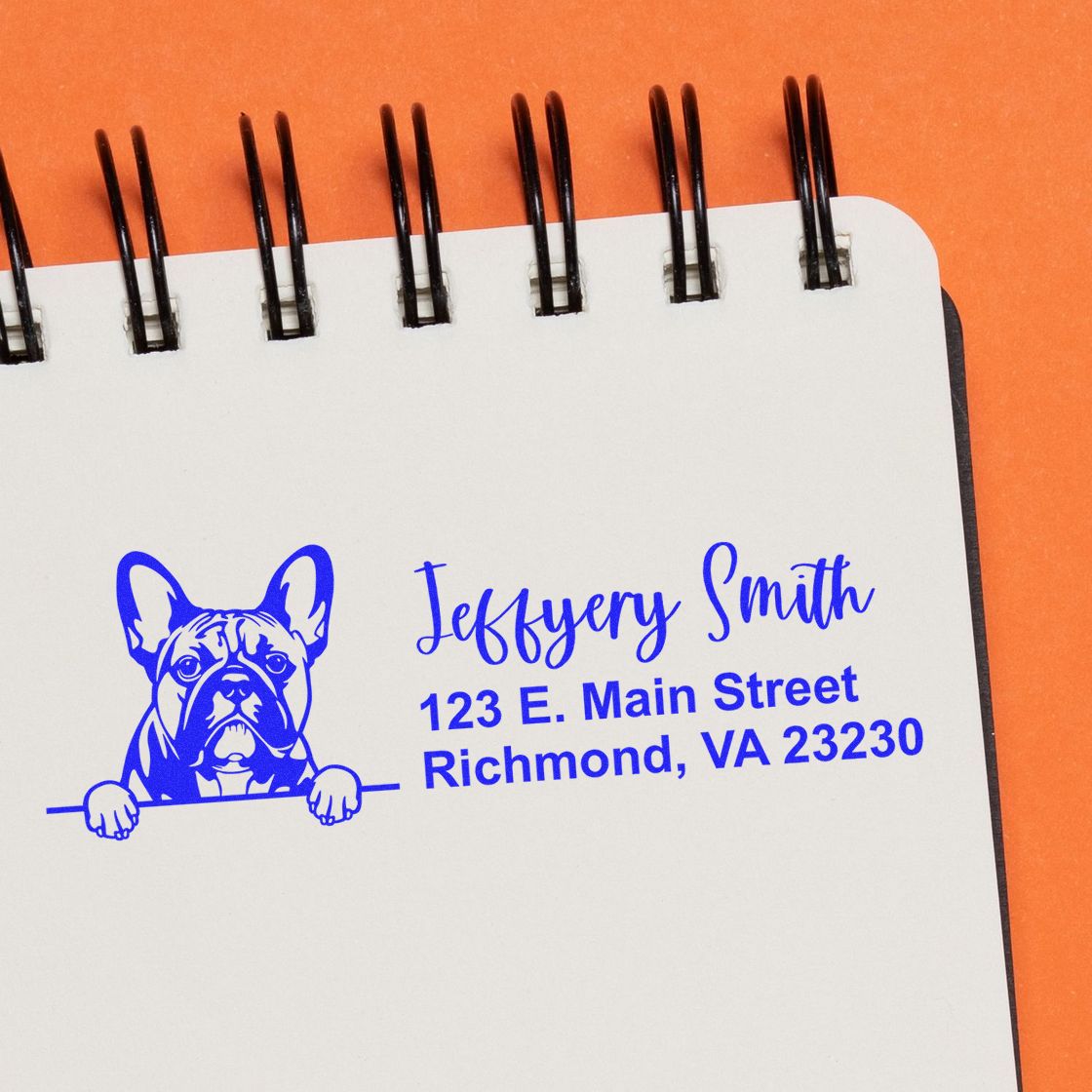 Personalized bulldog address rubber stamp with name and Richmond, VA address on a notebook page.