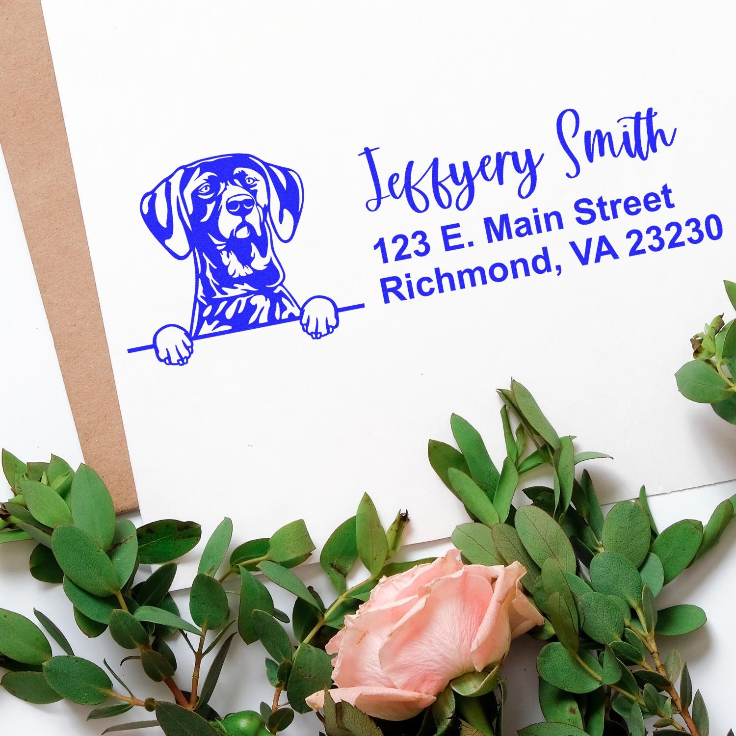 Custom dog return address rubber stamp in blue with pet illustration, name, and Richmond, VA address on envelope.
