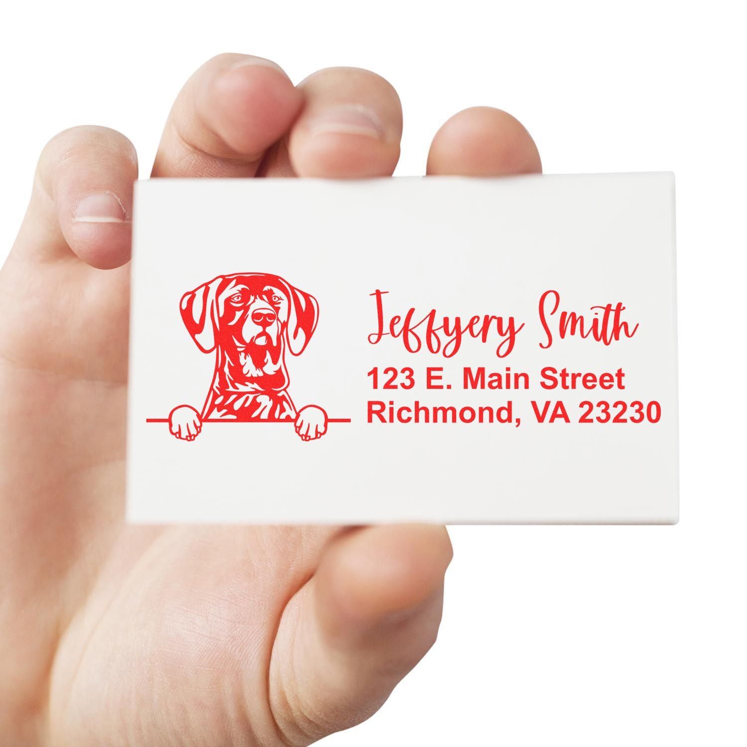 Custom dog return address rubber stamp with personalized name and Richmond, VA address, held in hand for mailing labels