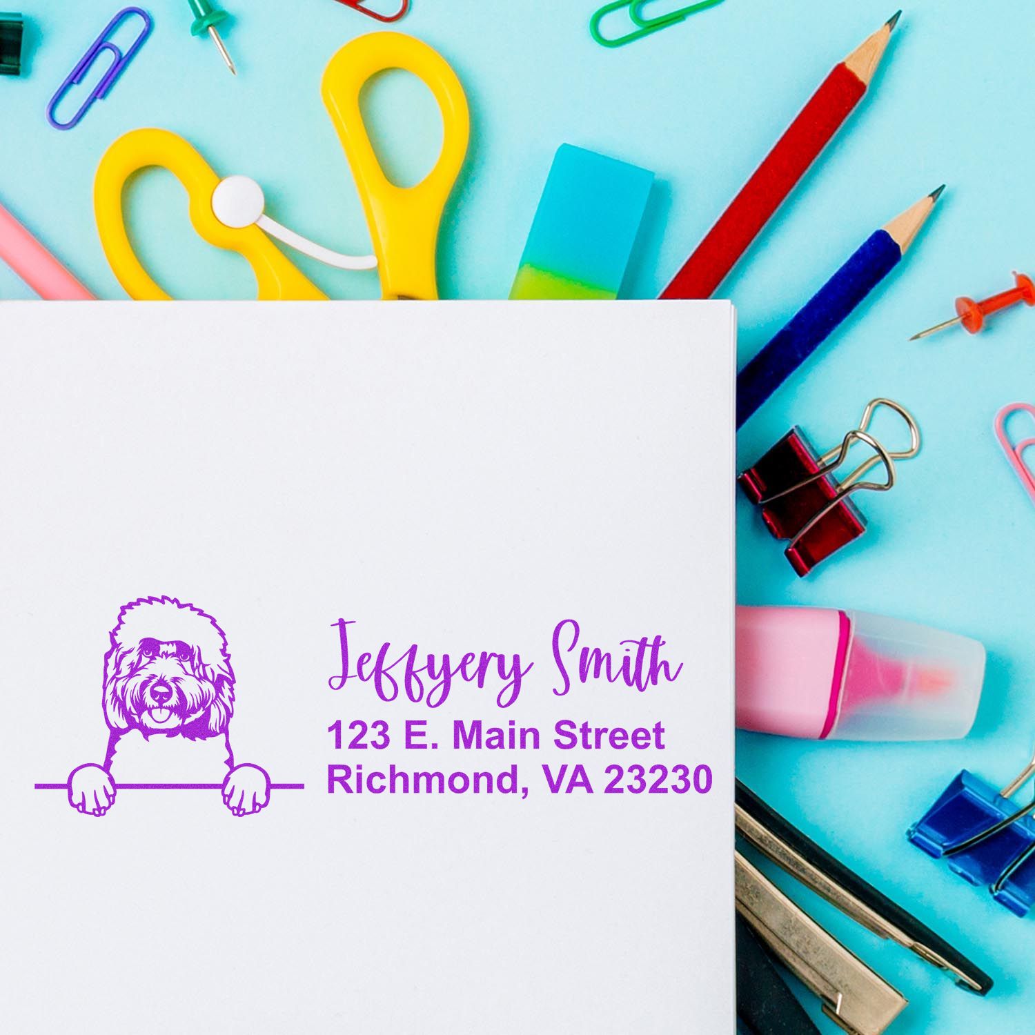 Personalized return address rubber stamp with dog logo, name, and Richmond VA address on stationery.