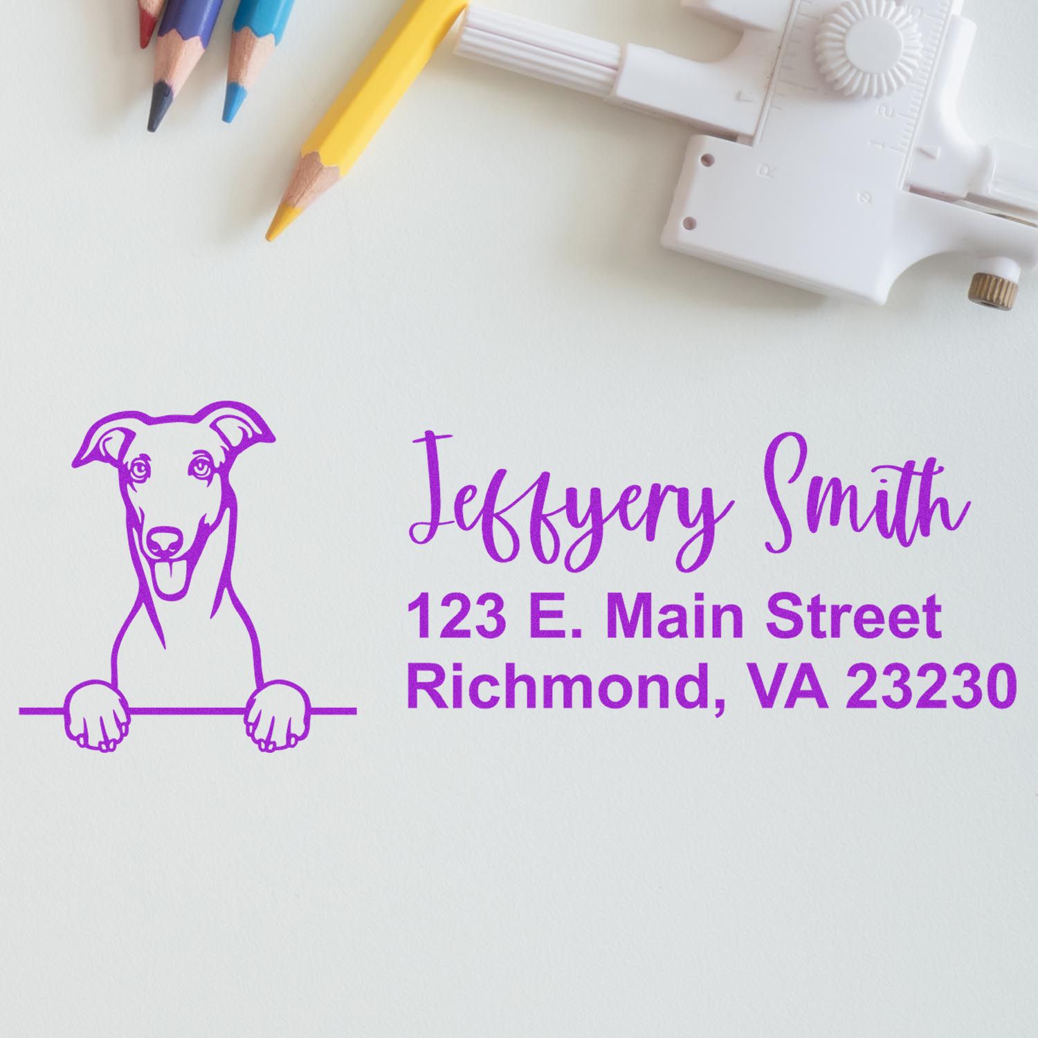 Custom rubber return address stamp with dog logo, name, and Richmond, VA address for mailing and packaging.