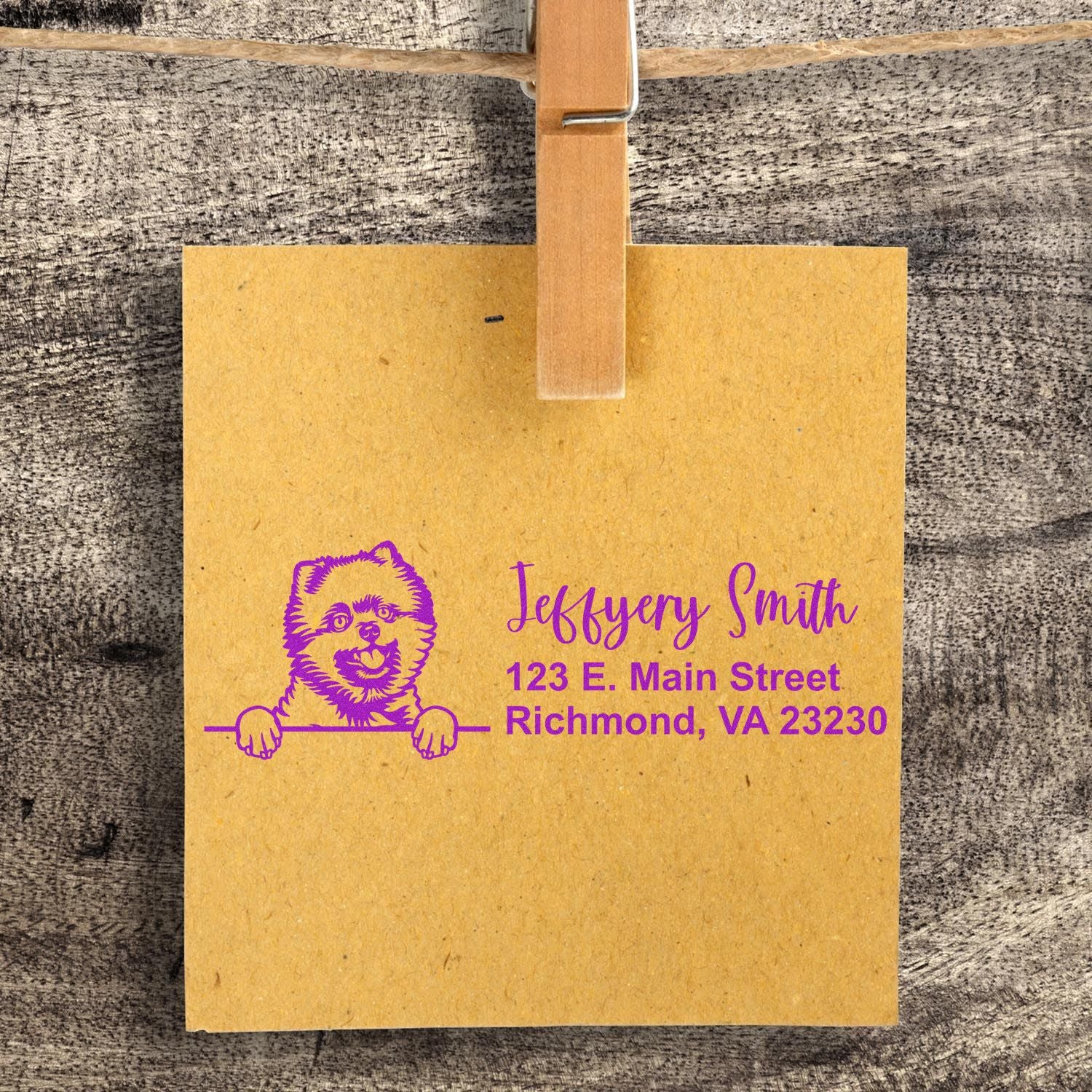 Custom address rubber stamp with dog logo, showing Jeffery Smith return address on kraft paper.