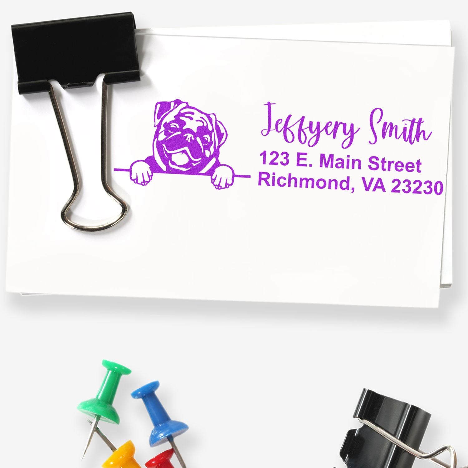 Custom rubber address stamp with dog logo, name, and mailing address for personalized business envelopes.