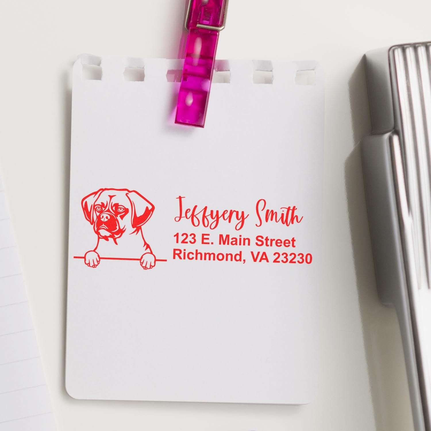 Custom rubber address stamp with dog logo, Jeffrey Smith name, and Richmond, VA address in red ink on paper.