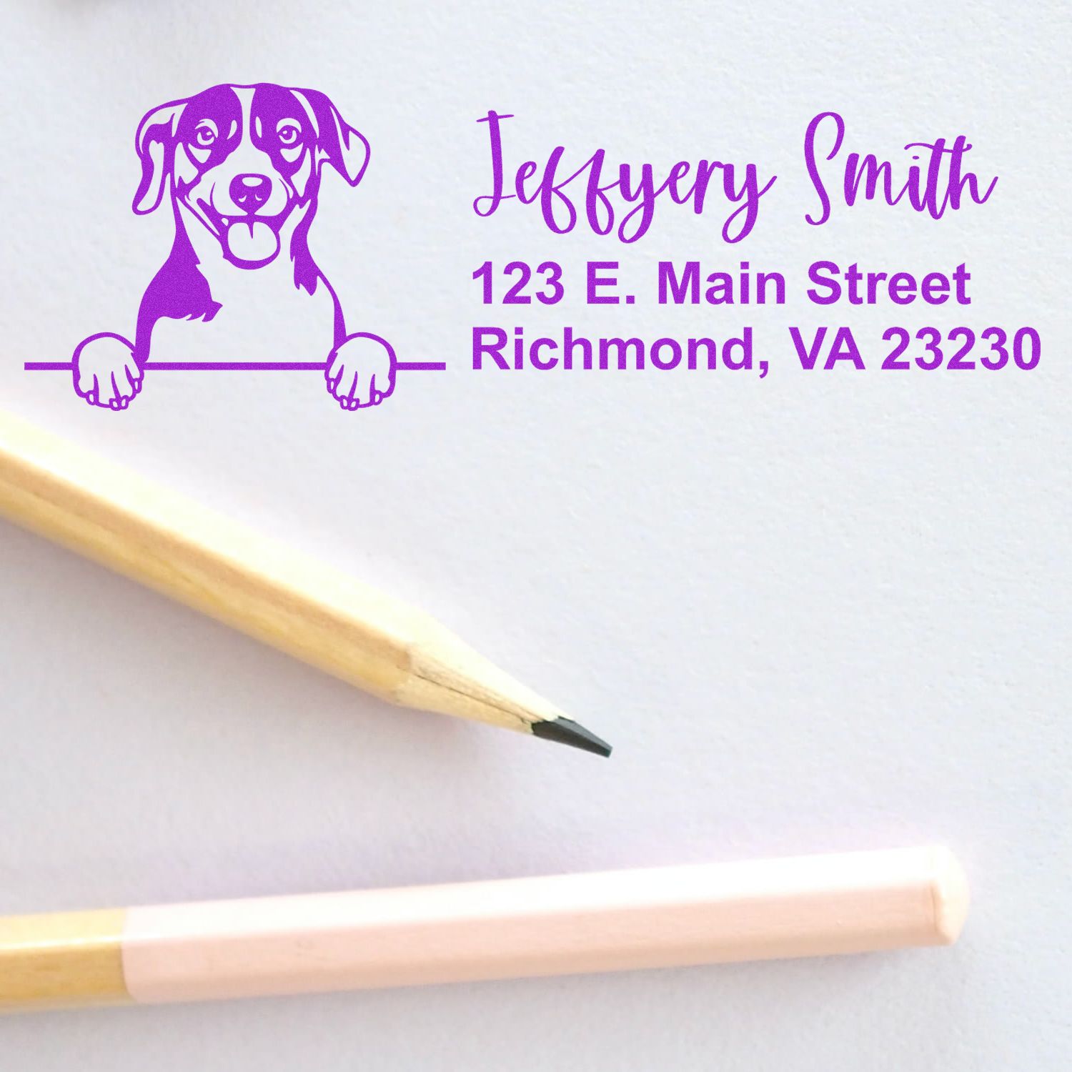 Personalized purple rubber address stamp with dog illustration for Jeffery Smith, Richmond, VA 23230.