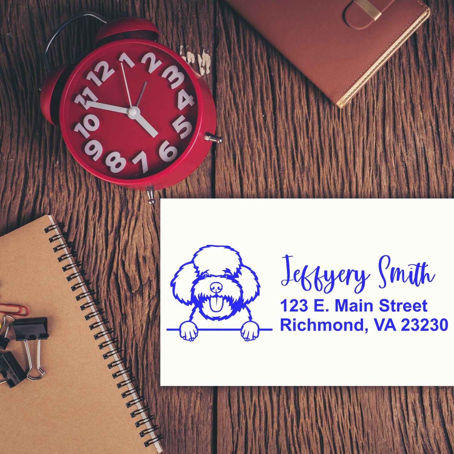 Custom return address rubber stamp with dog logo, name, and mailing address for personalized business or home use.
