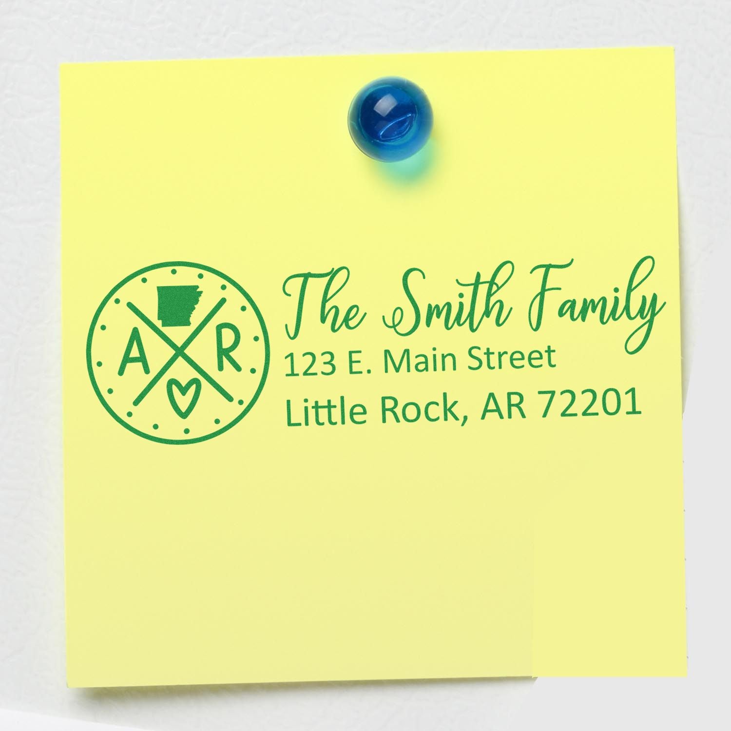 Custom family address rubber stamp on yellow note, with Arkansas monogram logo and The Smith Family mailing address.