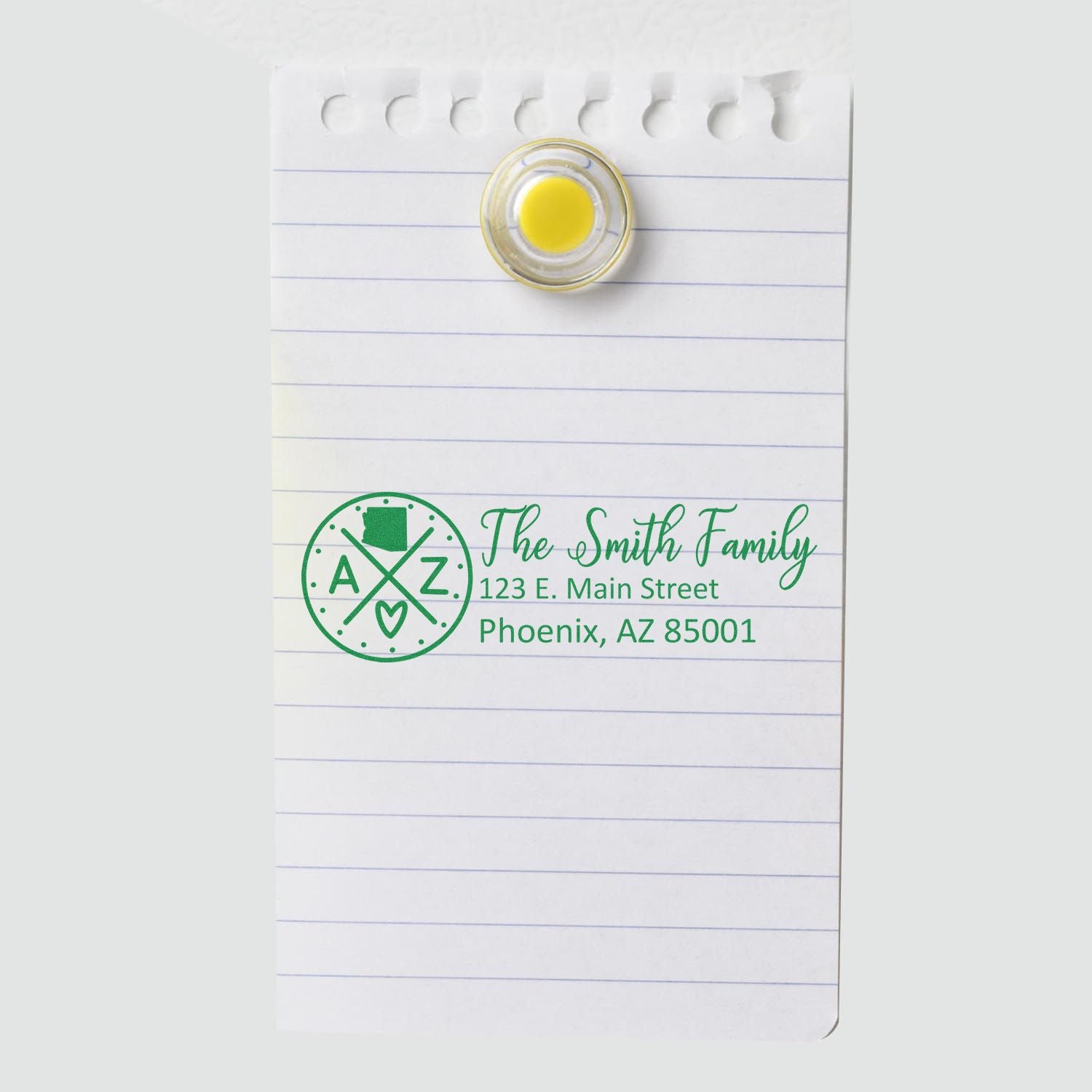 Custom return address rubber stamp impression with Smith family name and Phoenix, AZ address on lined paper.