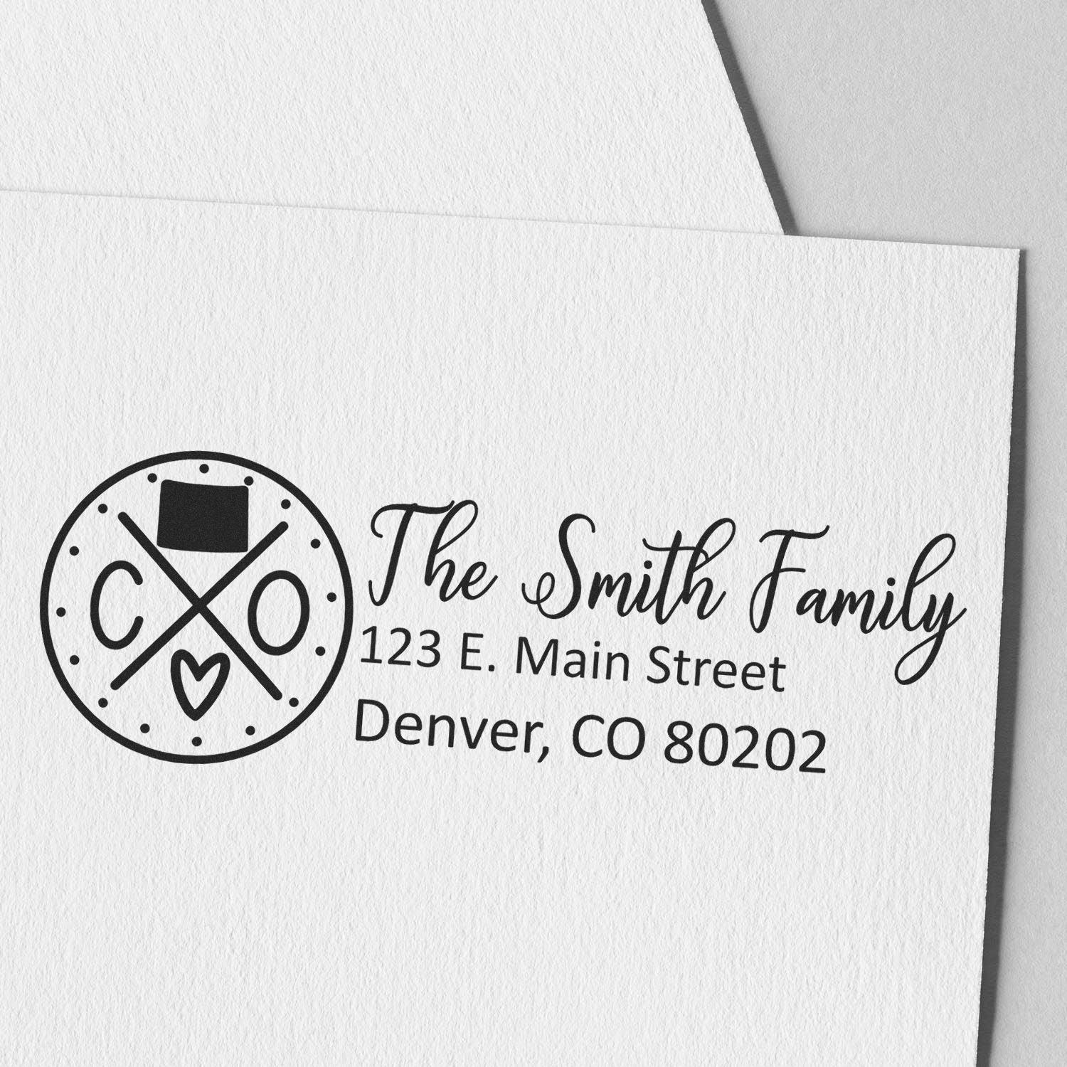 Personalized family return address rubber stamp with monogram logo for envelopes, featuring The Smith Family and Denver, CO.