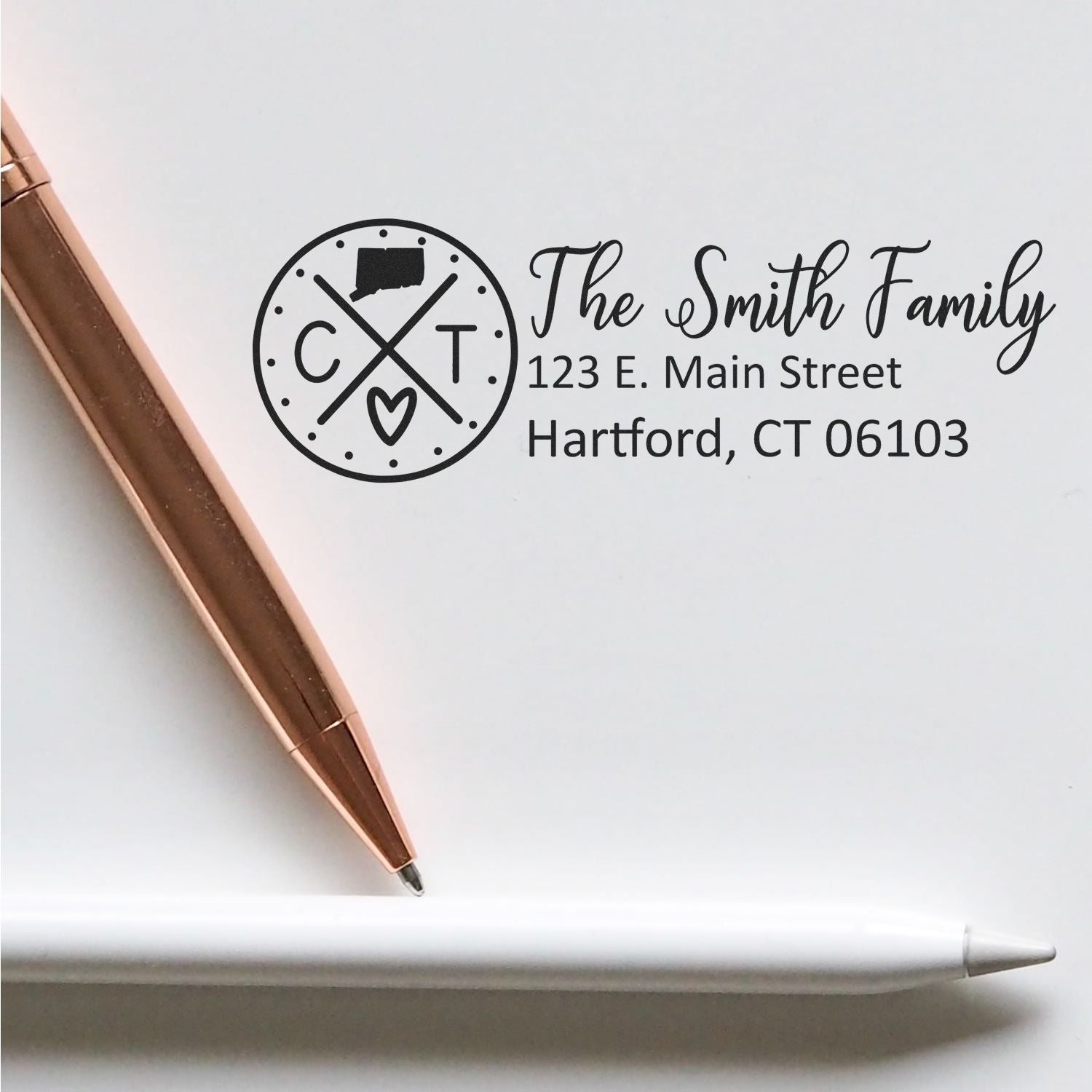 Personalized return address rubber stamp with monogram logo, The Smith Family, 123 E. Main Street, Hartford, CT 06103.