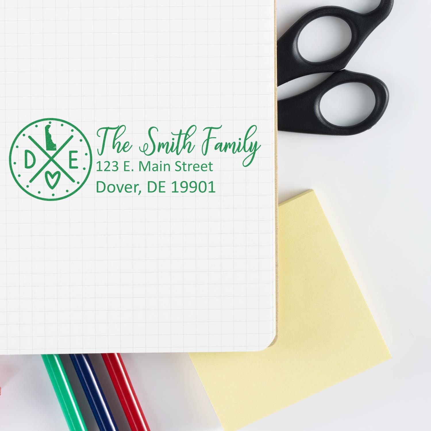 Custom family return address rubber stamp with monogram and Dover, DE address for personalized mailing and stationery.