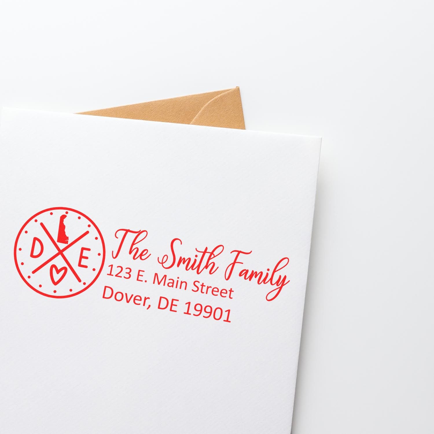 Custom family return address rubber stamp with monogram, shown on a white envelope with Dover, DE mailing address.