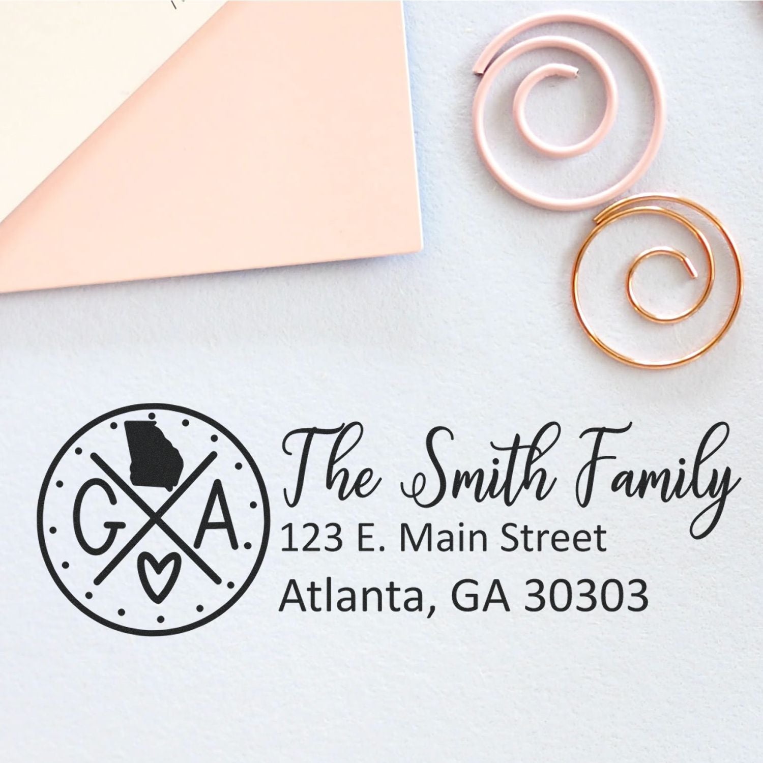 Personalized return address rubber stamp for The Smith Family, Atlanta, GA 30303, with Georgia monogram logo.