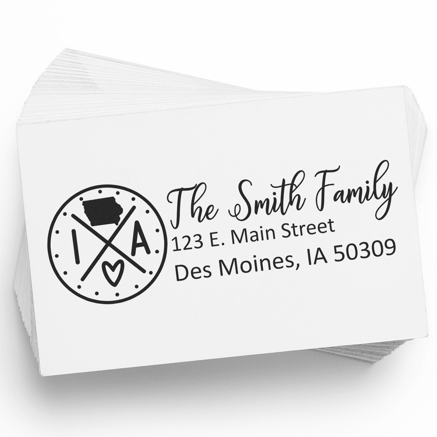 Custom return address rubber stamp for The Smith Family, Des Moines, IA 50309, with monogram-style logo.
