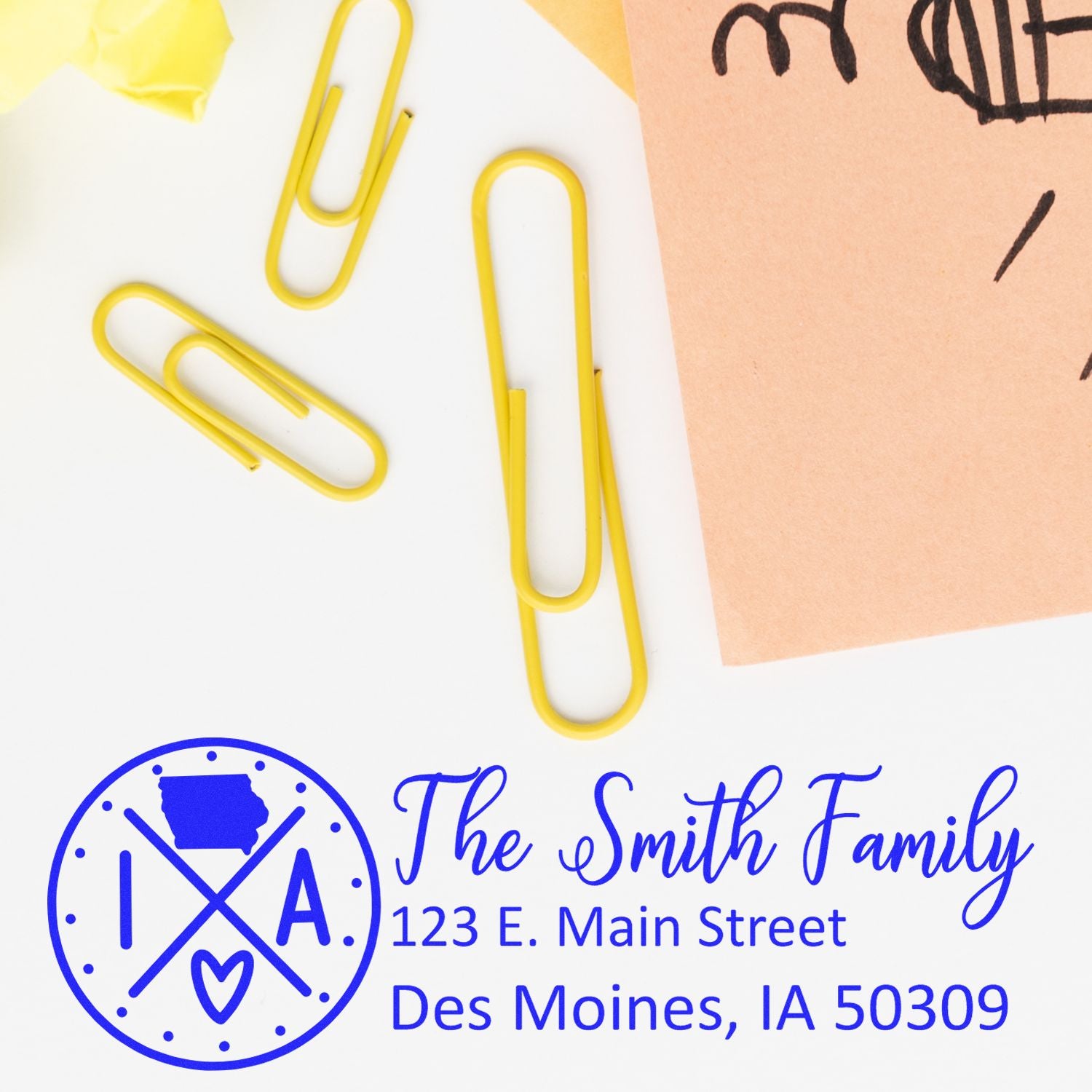 Personalized custom return address rubber stamp with family name and Des Moines, IA address in blue ink