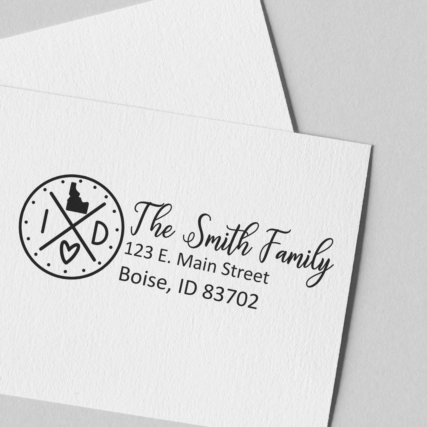 Custom return address rubber stamp for The Smith Family, with logo and Boise, ID mailing address.
