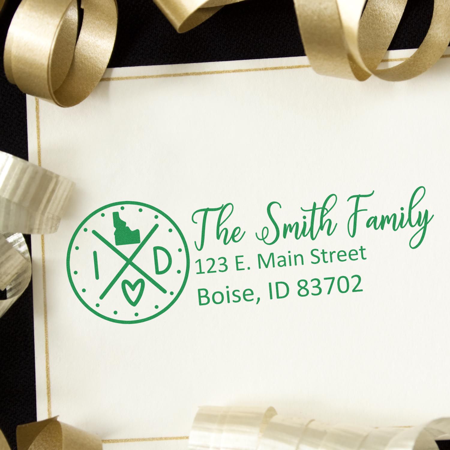 Personalized rubber return address stamp for The Smith Family with monogram logo and Boise, ID address.