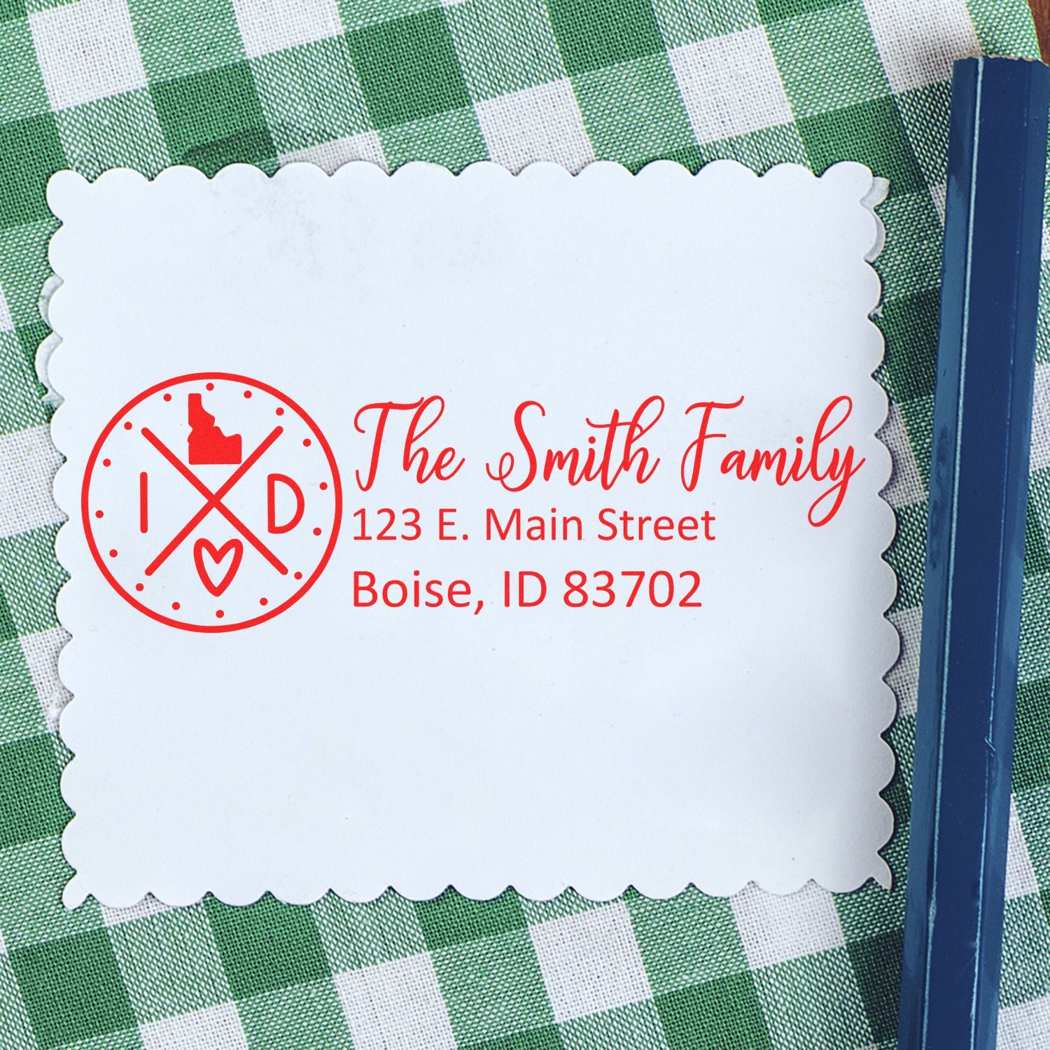 Custom return address rubber stamp with family name, Idaho address, and monogram design for wedding or personal mailing.