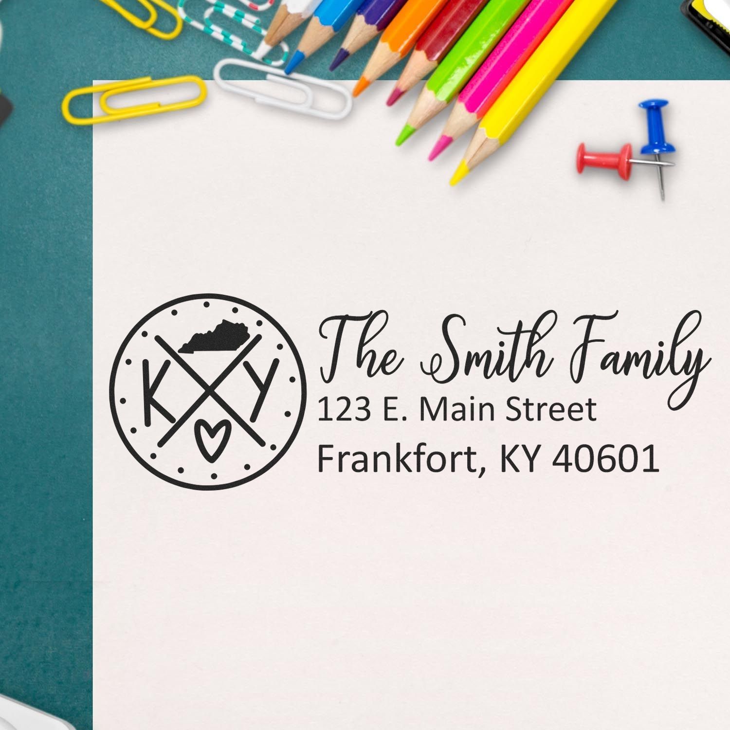 Personalized rubber address stamp with family monogram logo and return address, ideal for custom stationery and envelopes.