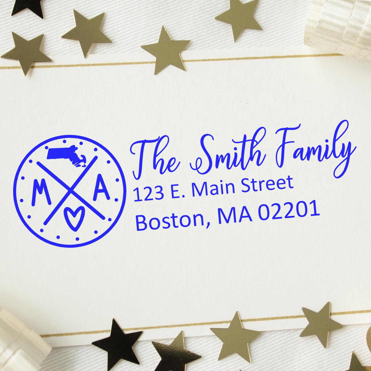 Personalized family return address rubber stamp with monogram and address in blue ink on envelope.