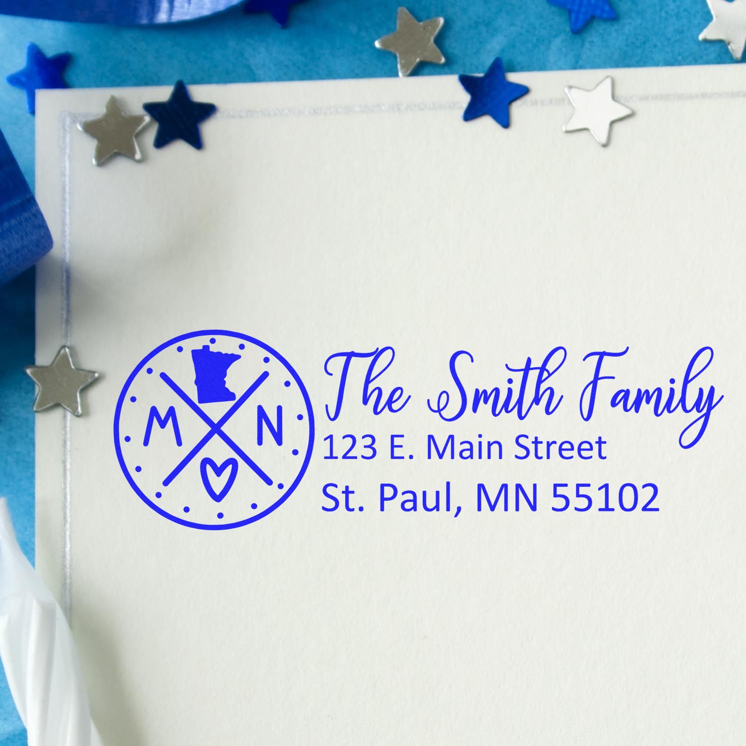 Personalized return address rubber stamp with family name, logo, and St. Paul, MN mailing address.