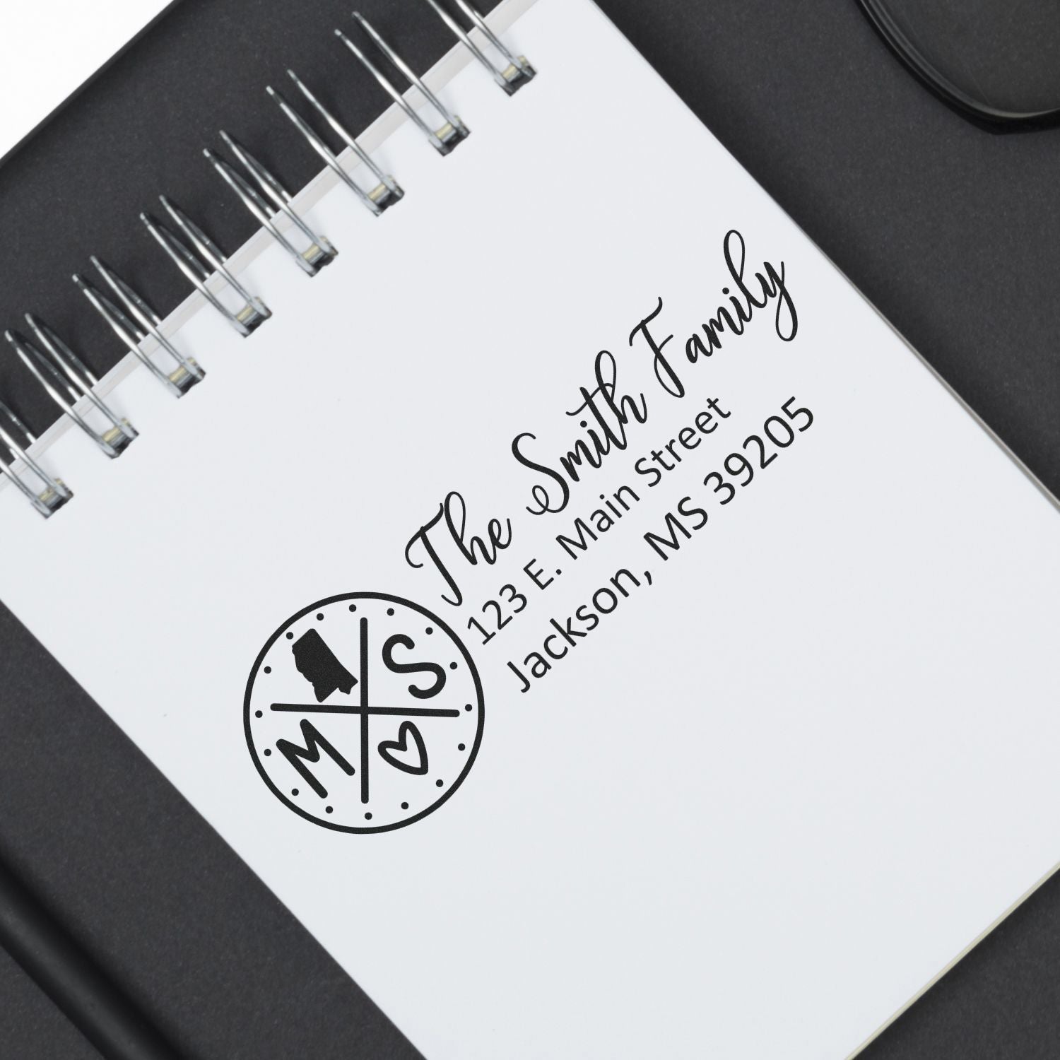 Custom rubber address stamp for The Smith Family with Mississippi monogram logo, ideal for personalized stationery and envelopes.