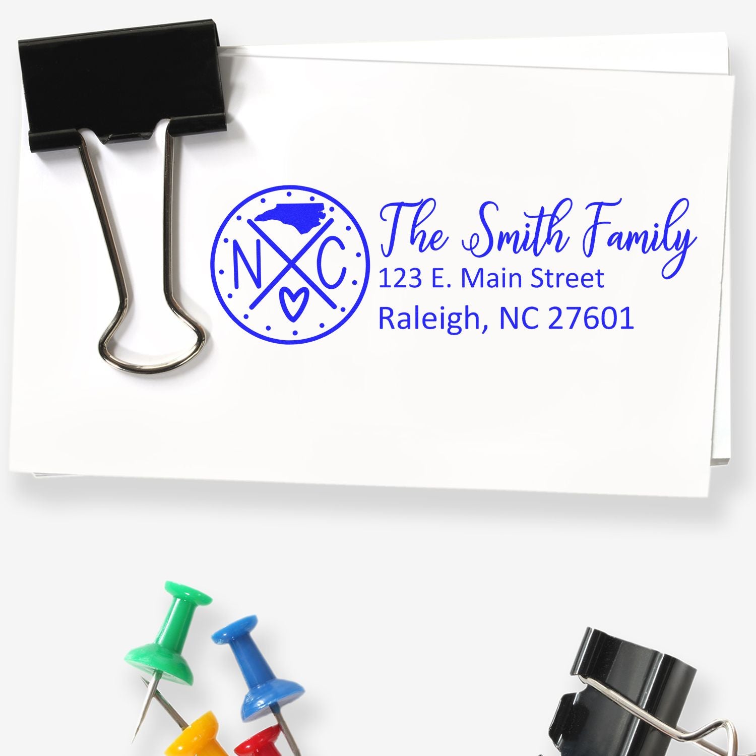 Custom family return address rubber stamp for envelopes, featuring monogram and Raleigh, NC address imprint.