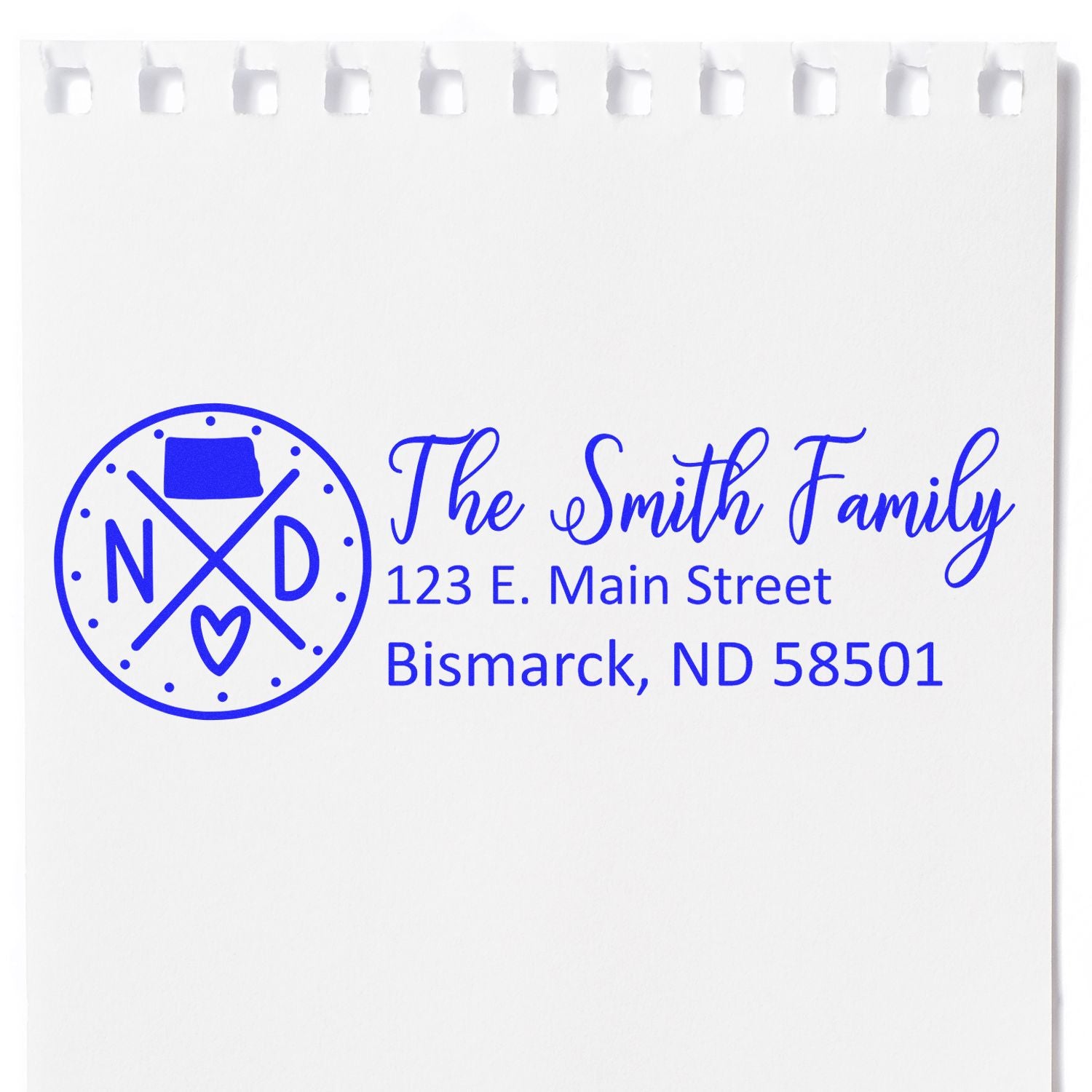 Custom family return address rubber stamp with monogram logo for The Smith Family, 123 E. Main Street, Bismarck, ND 58501.