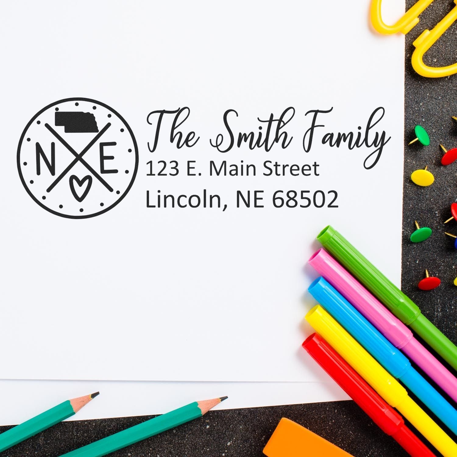Custom family return address rubber stamp with Nebraska monogram and The Smith Family, Lincoln, NE address.