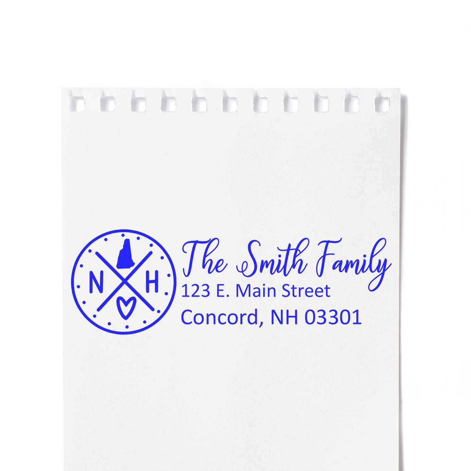 Custom return address rubber stamp with personalized family monogram, name, and address in blue ink.