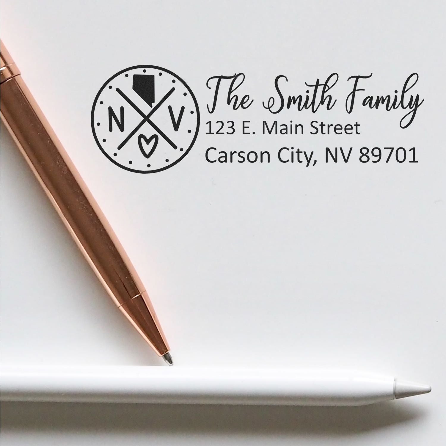 Custom family address rubber stamp with monogram logo, The Smith Family, Carson City, NV 89701, for personalized stationery.
