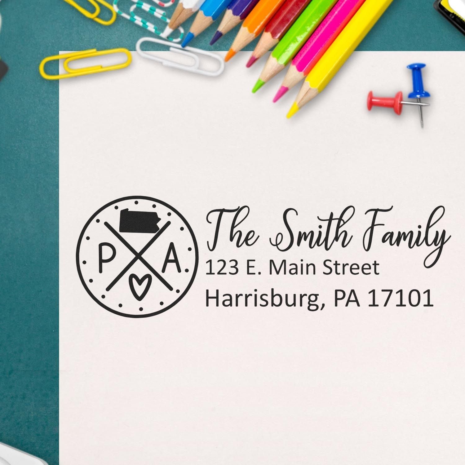 Custom family return address rubber stamp for The Smith Family, 123 E. Main Street, Harrisburg, PA 17101.