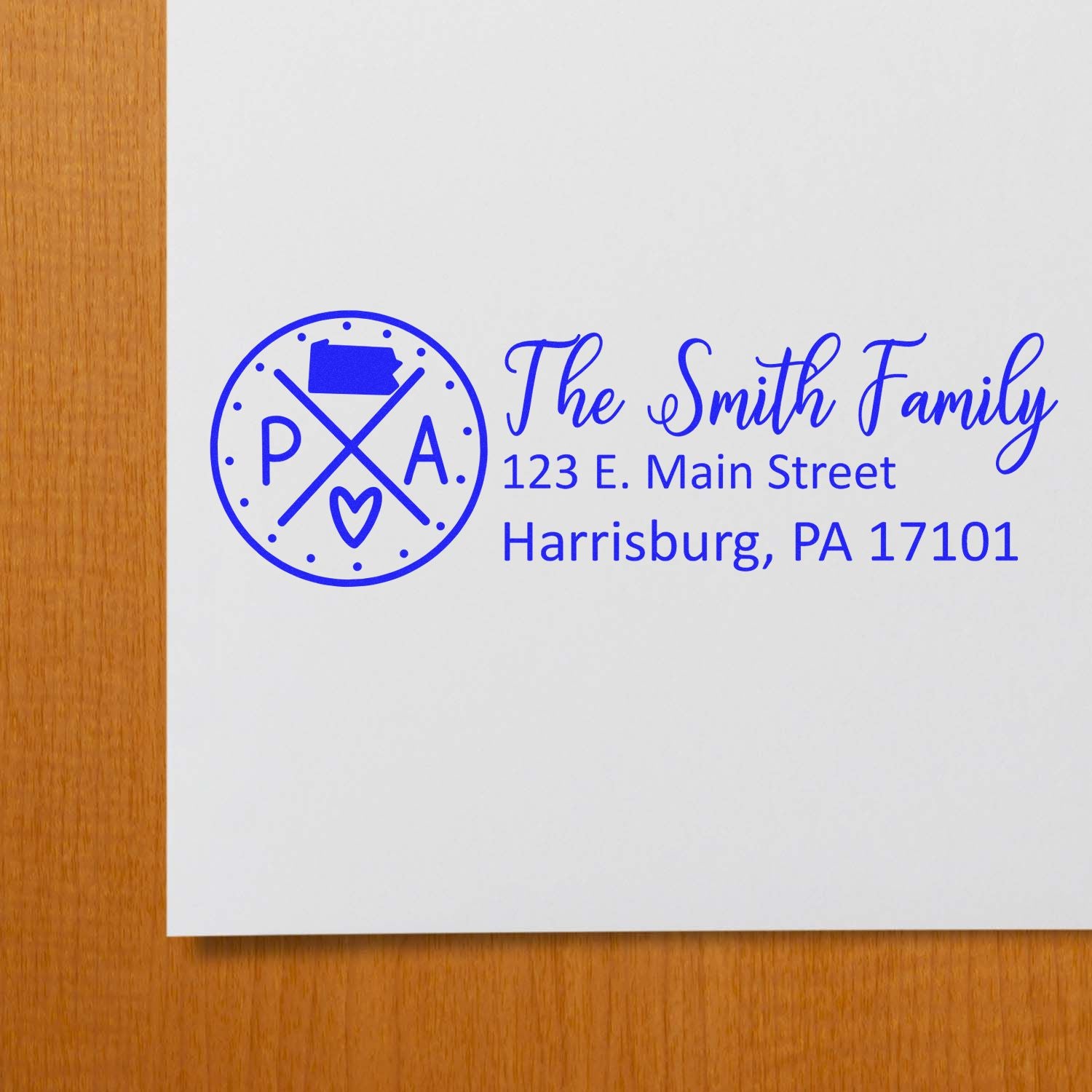 Personalized return address rubber stamp for The Smith Family, featuring custom name, logo, and Harrisburg, PA address.