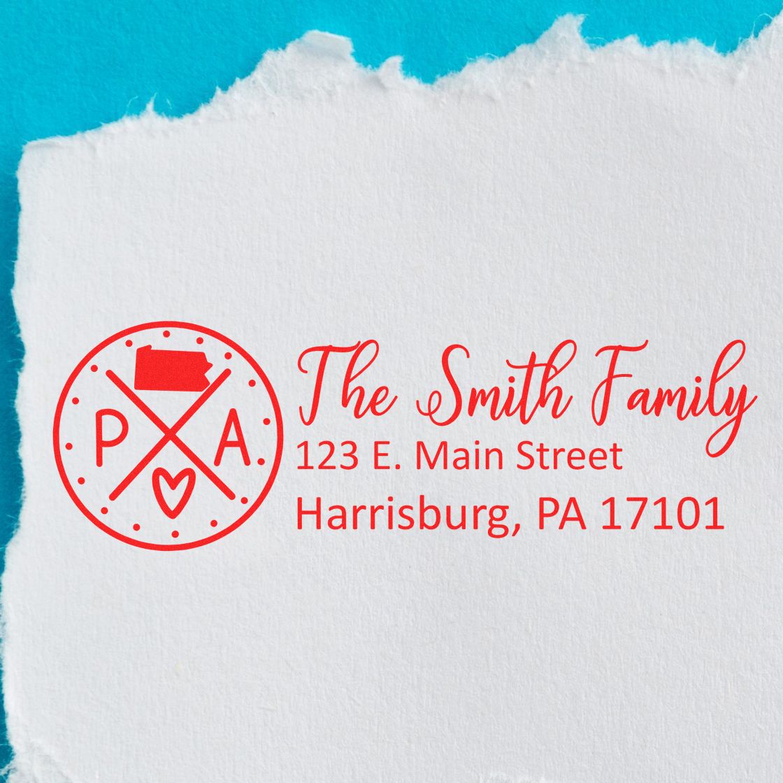 Personalized family address rubber stamp with monogram logo for The Smith Family in red ink.
