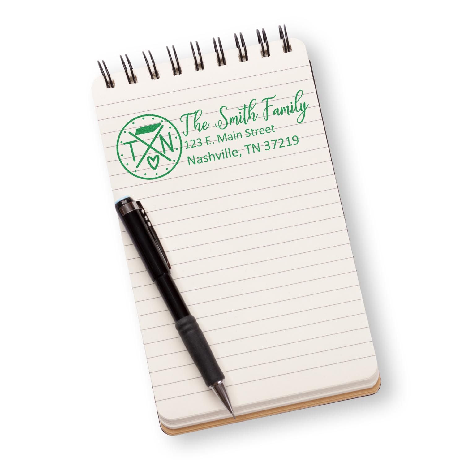Personalized family address rubber stamp with custom name and Nashville address on notebook, ideal for mailing and stationery.