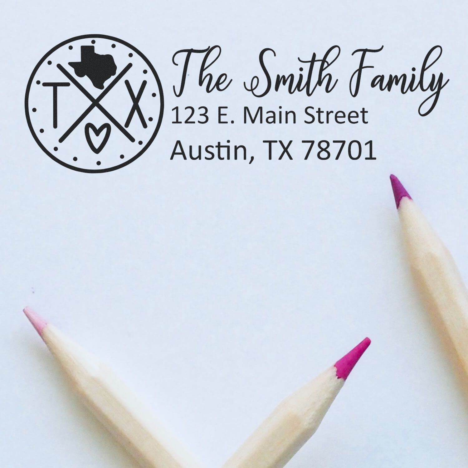 Custom return address rubber stamp for The Smith Family, 123 E. Main Street, Austin, TX 78701, with Texas monogram.