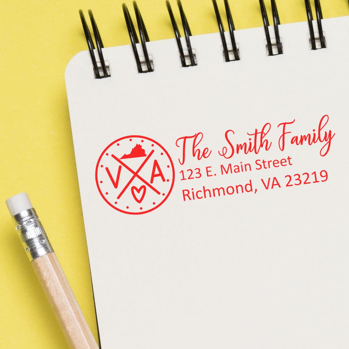 Custom family return address rubber stamp on notepad for personalized mailing, featuring The Smith Family in Richmond, VA.