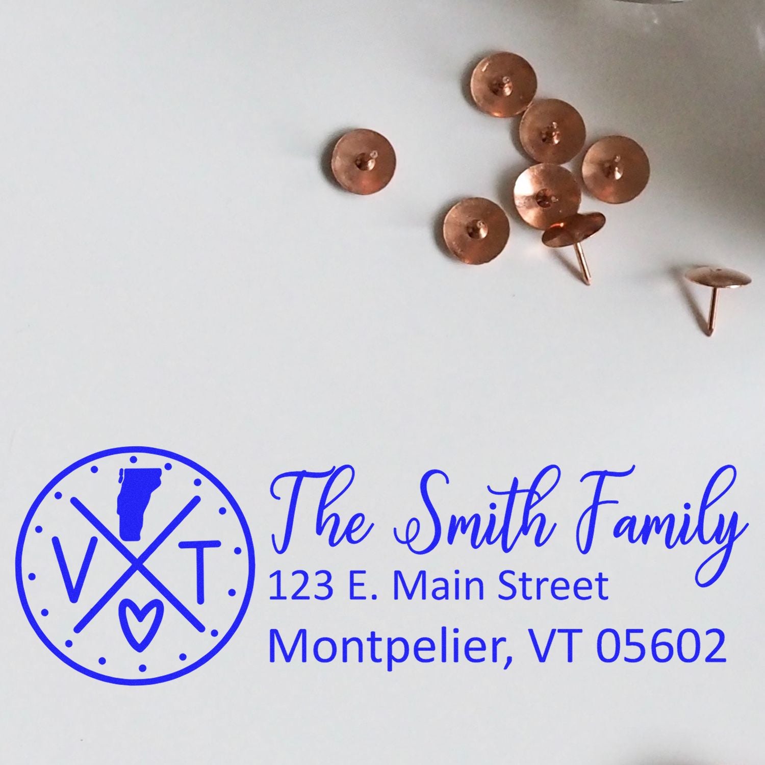 Custom return address rubber stamp for The Smith Family, 123 E. Main Street, Montpelier, VT 05602, with monogram design.