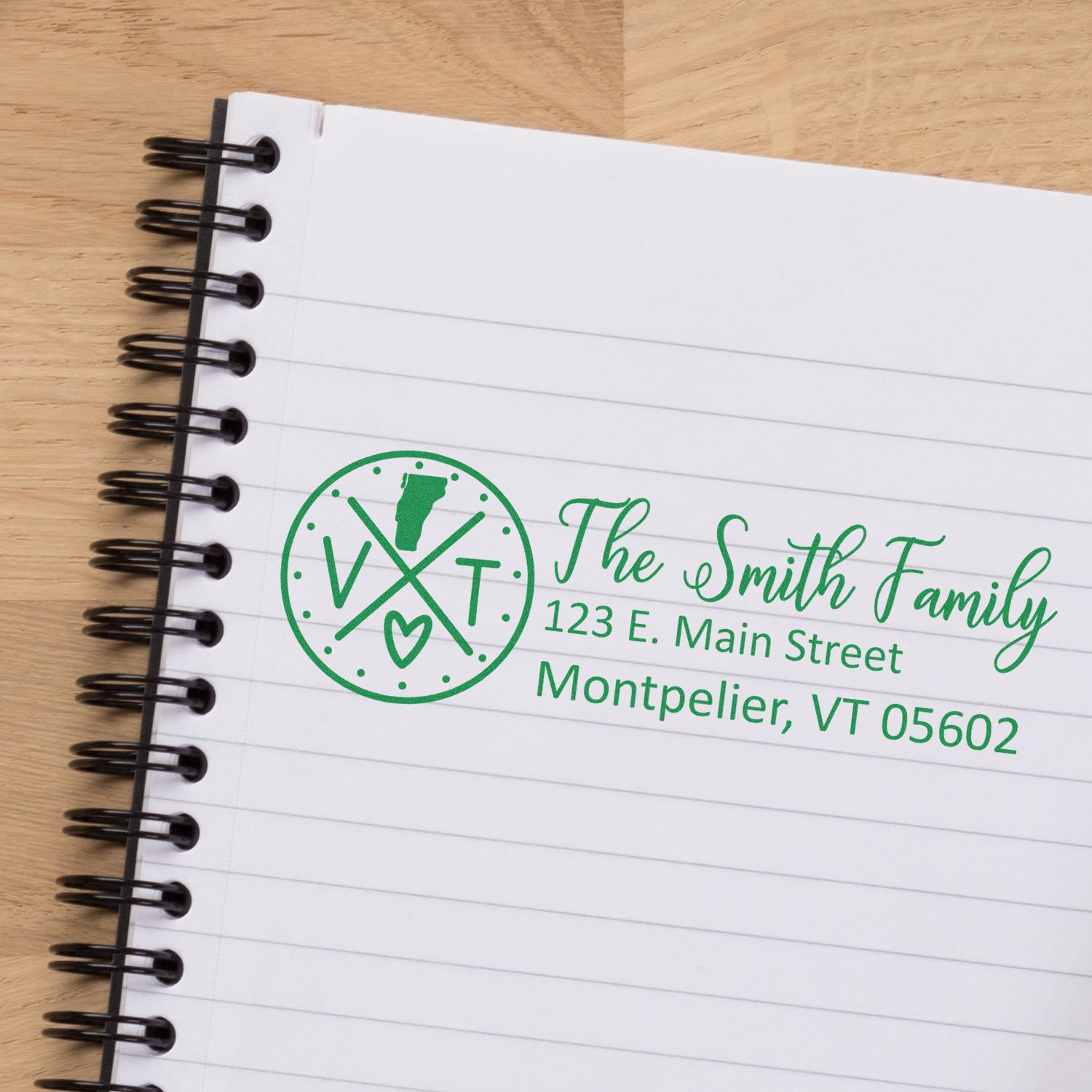 Custom family address rubber stamp for The Smith Family, Montpelier VT, on lined notebook paper.