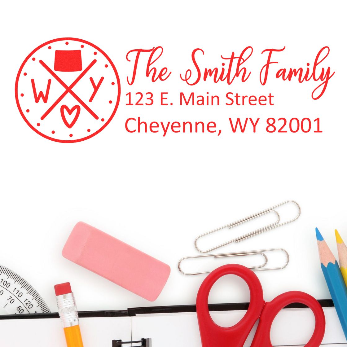 Custom return address rubber stamp for The Smith Family, 123 E. Main Street, Cheyenne, WY 82001, with monogram logo.